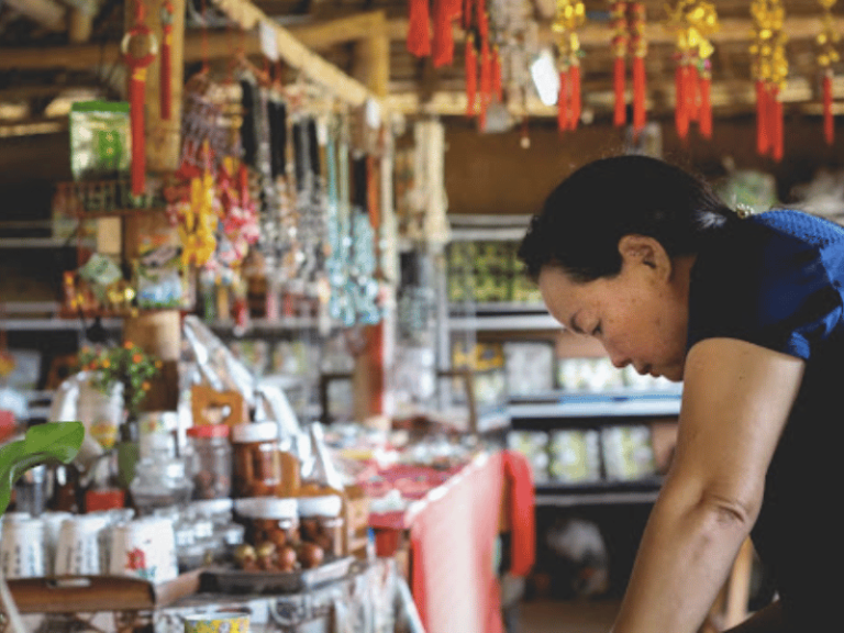 shopkeeper looking down