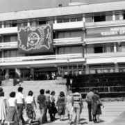 Black and white photo of group of students walking away towards a building in Alaska