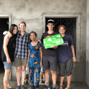 putney students with the recipient of the new home
