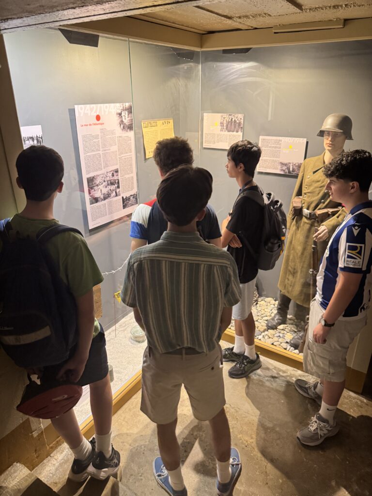 Students view display in La Musée de la Memoire in Le Conquet. 