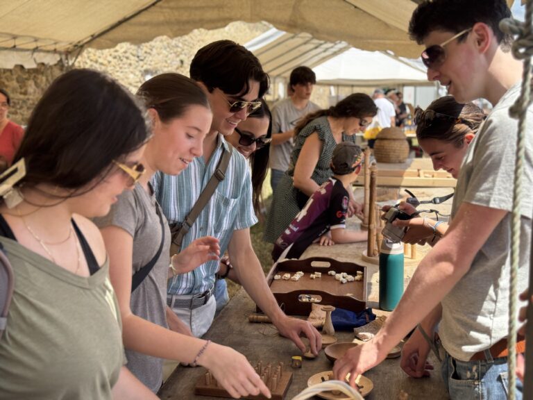 Students look at local artisan crafts at Festival of the West in Le Conquet. 