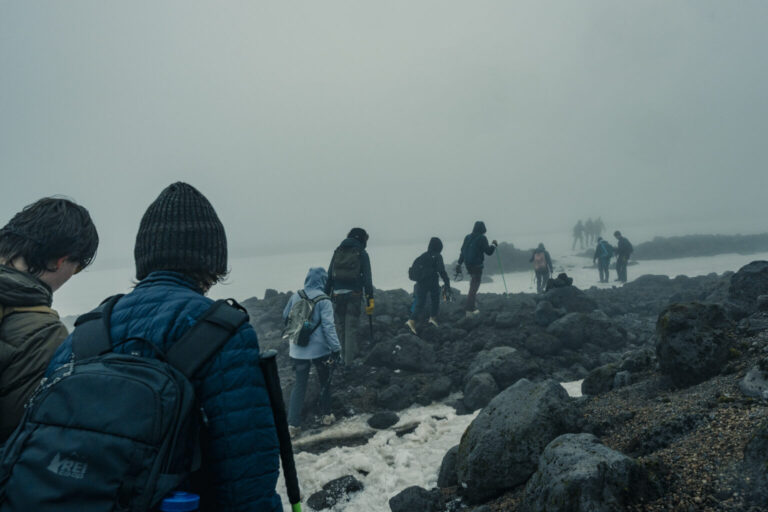 Students trek a snowy mountain in Iceland